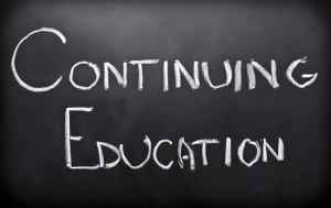 Continuing education written on classroom blackboard